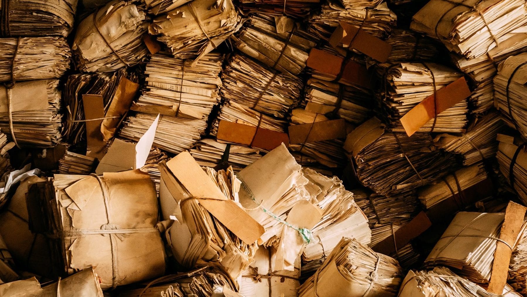 cropped-old-paper-waste-vintage-keeping-records-in-heaps.jpg